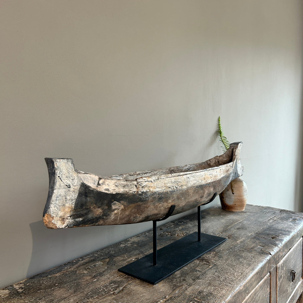 Antique wooden boat on stand | Krishna