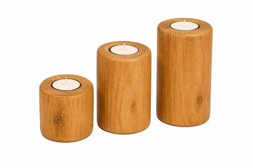 Three wooden candle holders with candles on a white background