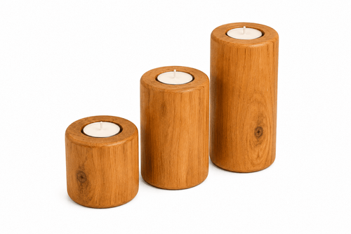 Three wooden candle holders with candles on a white background