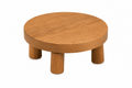 Wooden stool with a round top and four legs on a white background