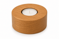 Wooden candle holder with a lit candle on a white background