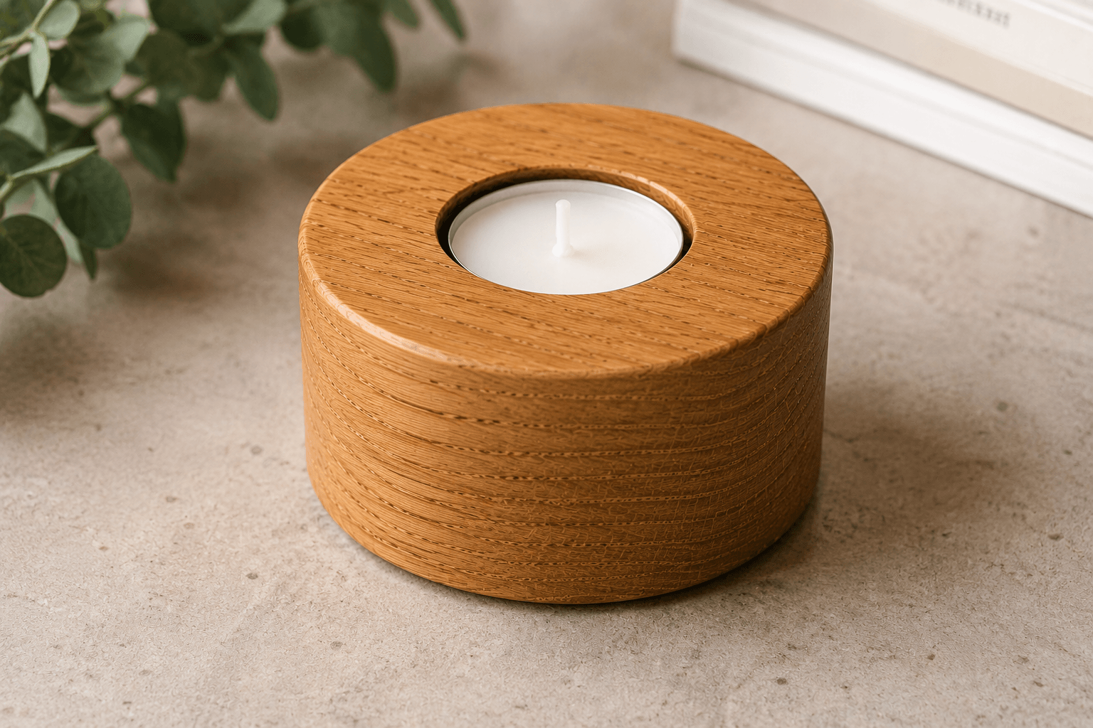 Wooden candle holder with a lit candle on a light surface, with greenery in the background.